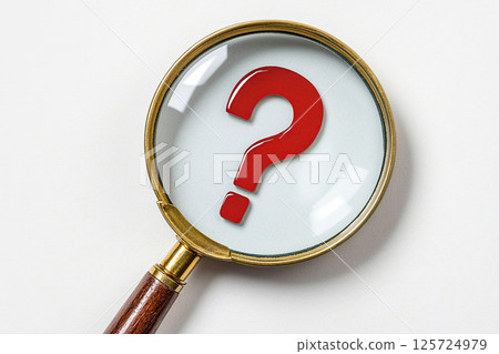 Magnifying glass reveals a bold red question mark on a plain background Magnifying glass reveals a bold red question mark on a plain background 125724979