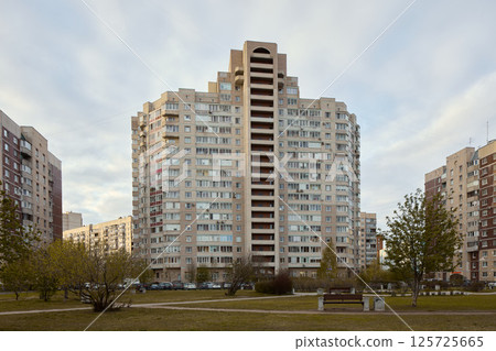 A Contemporary Modern Residential Building Nestled Within the Vibrant Urban Landscape A Contemporary Modern Residential Building Nestled Within the Vibrant Urban Landscape 125725665
