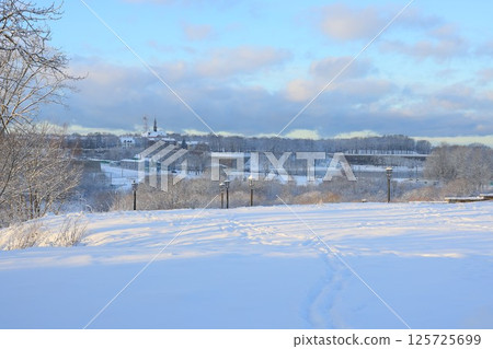 Serene and Beautiful Winter Landscape Comprising SnowCovered Hills and Scenic Views 125725699