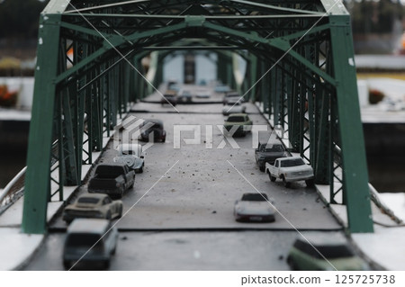 Miniature Bridge display with Model Cars, highlighting intricate details and design elements Miniature Bridge display with Model Cars, highlighting intricate details and design elements 125725738