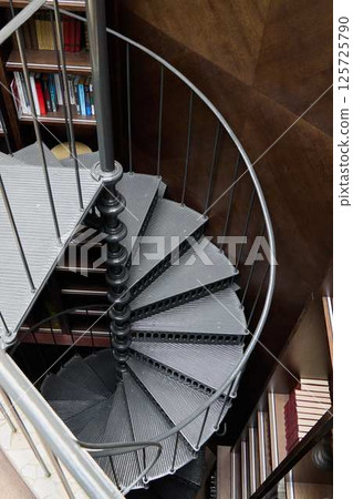An Elegant Spiral Staircase Featured in a Modern Interior Design Setting That Captivates An Elegant Spiral Staircase Featured in a Modern Interior Design Setting That Captivates 125725790