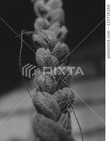 Beautiful and Intricate Braided Textile Detail in Elegant Black and White Colors Beautiful and Intricate Braided Textile Detail in Elegant Black and White Colors 125726168