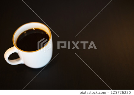 Coffee Mug On Wooden Table. Background for advertising and wallpaper in drink and coffee scene. Coffee Mug On Wooden Table. Background for advertising and wallpaper in drink and coffee scene. 125726220
