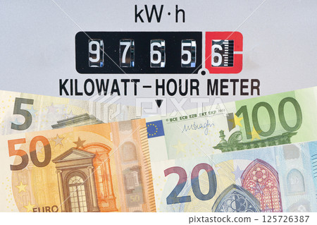 Electricity meter with Euro money energy cost. Electricity meter with Euro money energy cost. 125726387