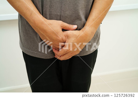 Hernia, Asian man stomach ache, abdominal pain and urology problem health. 125726392
