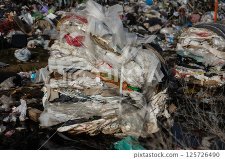 Layers of compacted trash are visible at a landfill site, highlighting the urgent need for better recycling and waste management practices Layers of compacted trash are visible at a landfill site, highlighting the urgent need for better recycling and waste management practices 125726490