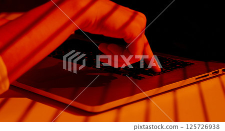 Finger Pressing Keyboard Button with Striped Light Shadows. 125726938