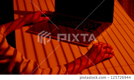 Shadows and Hands Using Laptop with External Mouse. 125726944