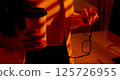 Closeup of Woman Holding Coffee Cup and Eyeglasses in Office. 125726955