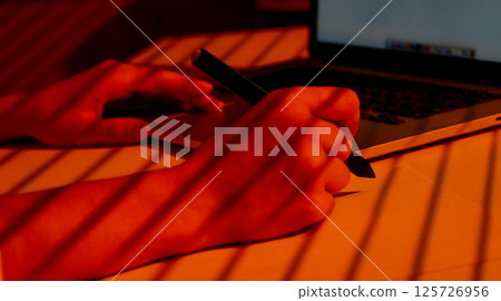 Woman Hand Drawing with Stylus Near Laptop Keyboard. Woman Hand Drawing with Stylus Near Laptop Keyboard. 125726956