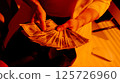 Close-Up of Female Hands Holding a Fan of US Dollar Bills. 125726960