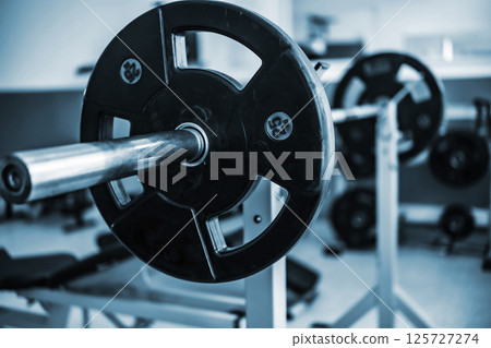 Barbell With Weight On Gym Rack For Fitness Barbell With Weight On Gym Rack For Fitness 125727274