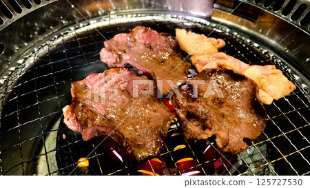 Premium beef tongue grilled on a charcoal grill Premium beef tongue grilled on a charcoal grill 125727530