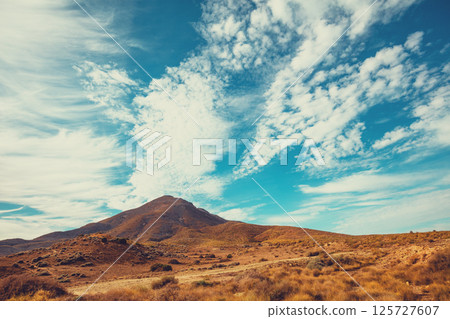 Mountain deserted landscape with beautiful cloudy sky Mountain deserted landscape with beautiful cloudy sky 125727607