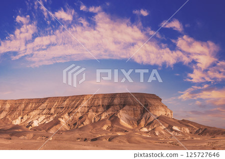 Mountainous desert in the morning. Judean desert in Israel at sunrise Mountainous desert in the morning. Judean desert in Israel at sunrise 125727646
