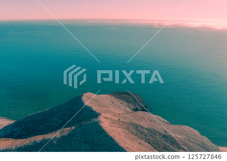 Rock in the sea. Crescent Cove. Aerial view. Cabo de Gata-Nijar reserve. Monsul cove. Almeria Andalusia Spain 125727846