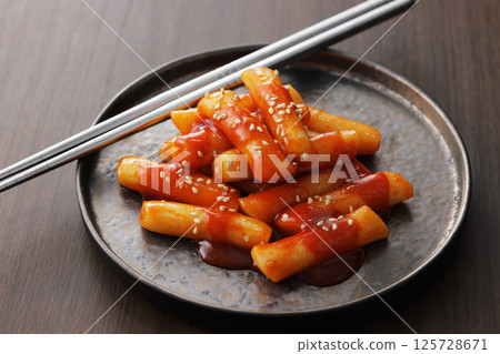 Spicy and delicious Korean tteokbokki served on a plate Spicy and delicious Korean tteokbokki served on a plate 125728671