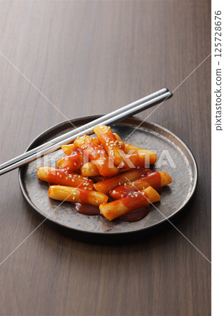 Spicy and delicious Korean tteokbokki served on a plate Spicy and delicious Korean tteokbokki served on a plate 125728676