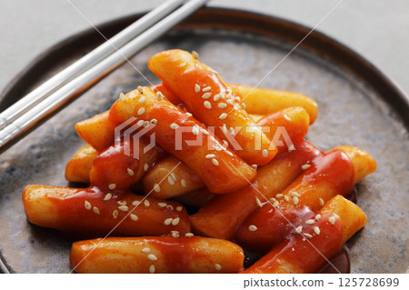 Spicy and delicious Korean tteokbokki served on a plate Spicy and delicious Korean tteokbokki served on a plate 125728699