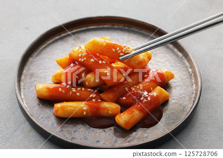 Spicy and delicious Korean tteokbokki served on a plate Spicy and delicious Korean tteokbokki served on a plate 125728706