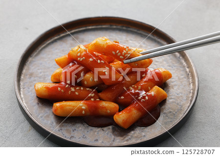 Spicy and delicious Korean tteokbokki served on a plate Spicy and delicious Korean tteokbokki served on a plate 125728707