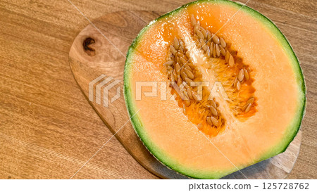 Fresh Yubari melon with delicious red fruit Fresh Yubari melon with delicious red fruit 125728762