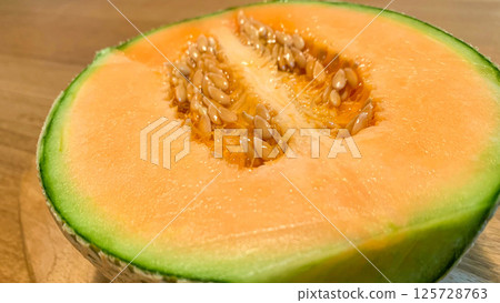 Fresh Yubari melon with delicious red fruit Fresh Yubari melon with delicious red fruit 125728763