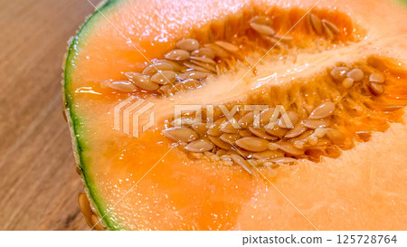 Fresh Yubari melon with delicious red fruit Fresh Yubari melon with delicious red fruit 125728764