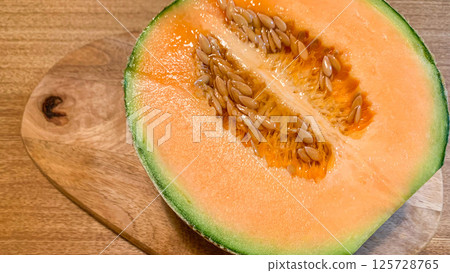 Fresh Yubari melon with delicious red fruit Fresh Yubari melon with delicious red fruit 125728765