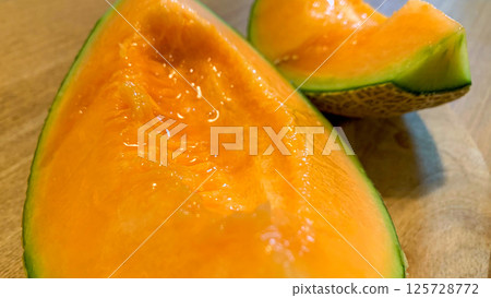 Fresh Yubari melon with delicious red fruit Fresh Yubari melon with delicious red fruit 125728772