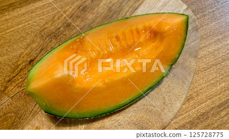 Fresh Yubari melon with delicious red fruit Fresh Yubari melon with delicious red fruit 125728775