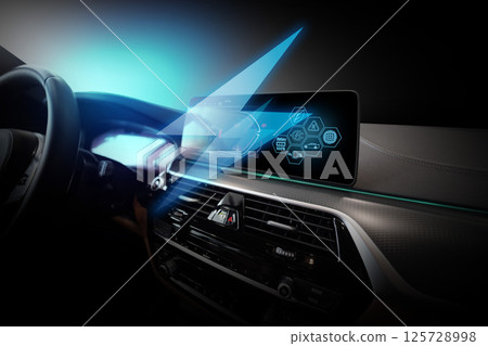 Electric car display screen that is showing the display of electric charging. 125728998