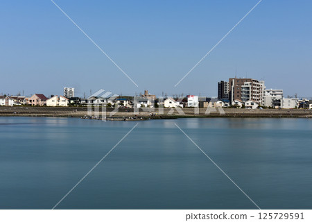 Clear May day: People enjoying the sea Clear May day: People enjoying the sea 125729591