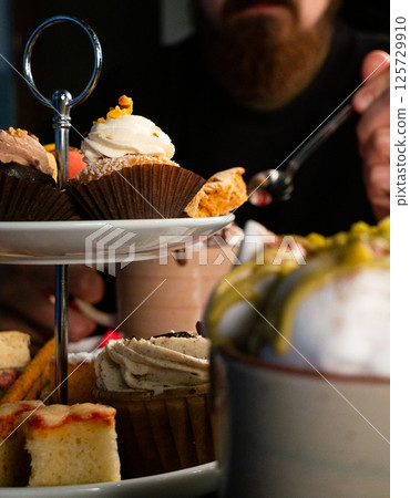 Indulging in Pastries and Coffee 125729910