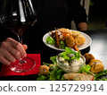 Enjoying Red Wine with Gourmet Appetizers 125729914