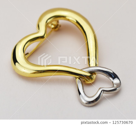 High quality brooch accessory for women vintage jewelry on minimalist background High quality brooch accessory for women vintage jewelry on minimalist background 125730670