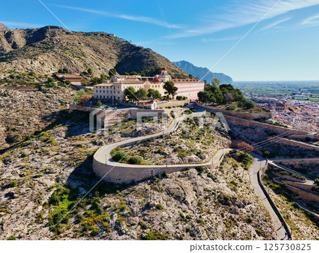 Curvy road goes up hill of San Miguel Diocesan Seminary. Orihuela Curvy road goes up hill of San Miguel Diocesan Seminary. Orihuela 125730825
