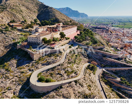 Curvy road goes up hill of San Miguel Diocesan Seminary. Orihuela 125730826