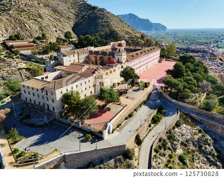 Curvy road goes up hill of San Miguel Diocesan Seminary. Orihuela 125730828