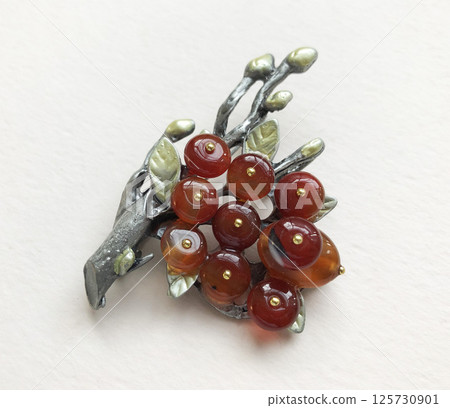 Romantic vintage brooch for women closeup on surface Romantic vintage brooch for women closeup on surface 125730901