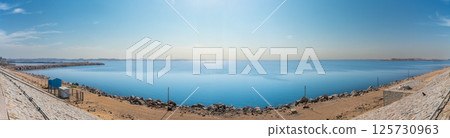 Panoramic view of Lake Nasser shoreline and calm waters on a sunny spring. 125730963