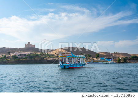 Tourist Boat on Nile River, Aswan, Egypt. Tourist Boat on Nile River, Aswan, Egypt. 125730980