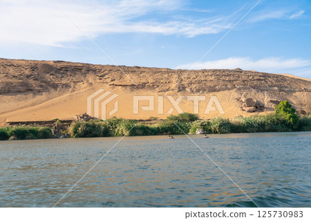 Nile River Landscape near Aswan Dam, Egypt. 125730983