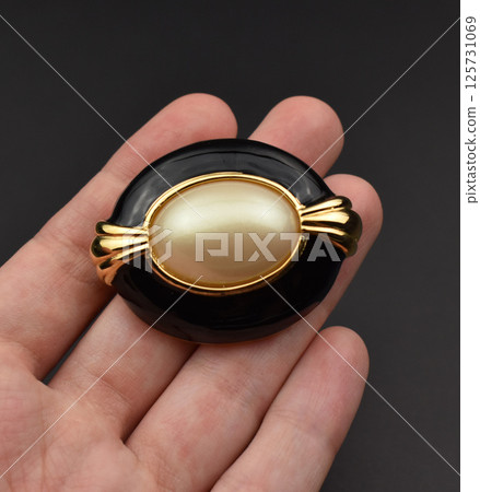 Handmade brooch vintage design closeup for womens jewelry 125731069