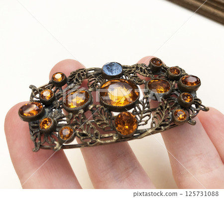 Close up of vintage brooch womens fashion accessory Close up of vintage brooch womens fashion accessory 125731088