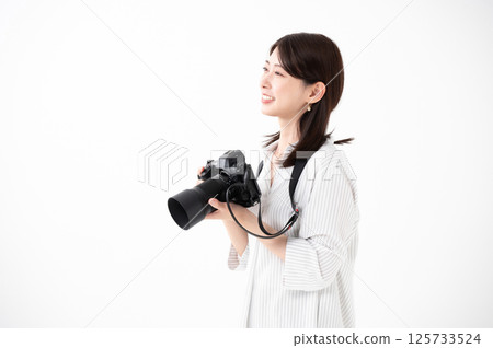 A woman with a camera A woman with a camera 125733524