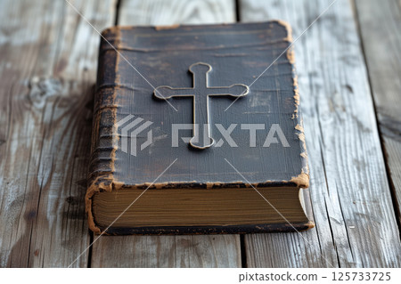 An Christian holy book Bible with cross on dark cover on wooden table AI Generative 125733725