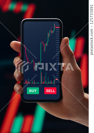 Hand of businessman using stock market app on smartphone 125733891