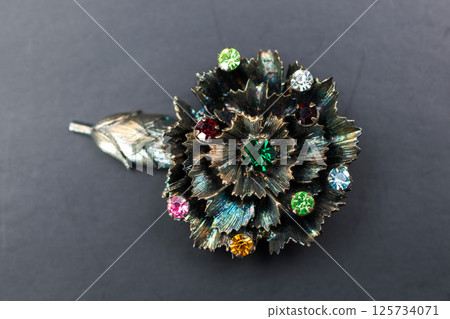 Brooch on cloth background floral vintage women accessory Brooch on cloth background floral vintage women accessory 125734071