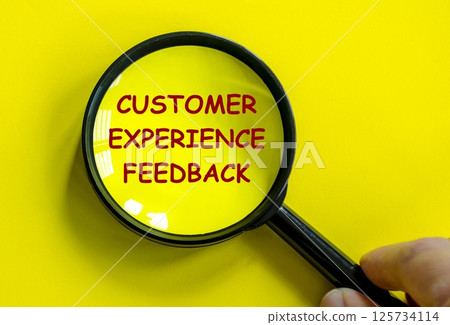 Top view of Customer Experience Feedback text on magnifying glass with yellow background. Top view of Customer Experience Feedback text on magnifying glass with yellow background. 125734114